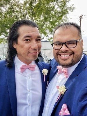 Groomsmen and best man rocking the blue suit with light pink bow tie and handkerchief.