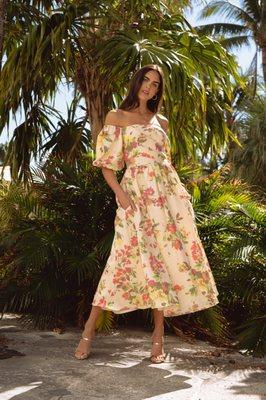 Gorgeous, floral jacquard midi dress. Style features off off-shoulder neckline with voluminous balloon sleeves...