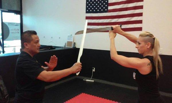 Eskrima drills with training swords.