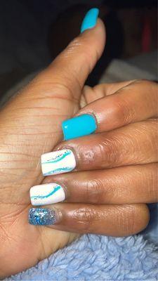 Tina does my nails and she does a bomb job especially with my designs and color themes