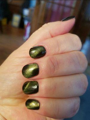 Cat's Eye nails in an emerald green. So many fun options at Polished on Main!