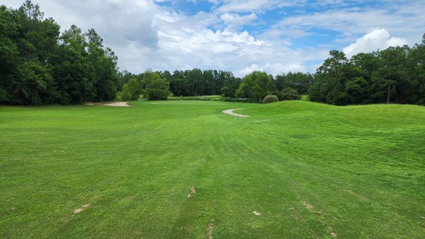 Approach into the green, back surrounded by water