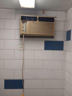 Broken and out dated air conditioners in bathroom