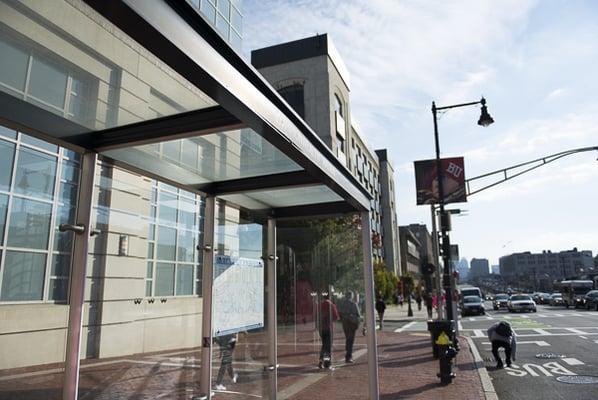 The Green B Line and 57 Bus stop directly in front of the building.