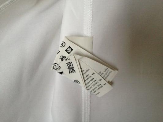 My blouse came back with a creased and folded tag with creases so deep that I couldn't even iron out myself.