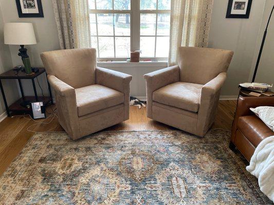 Two reupholstered chairs.