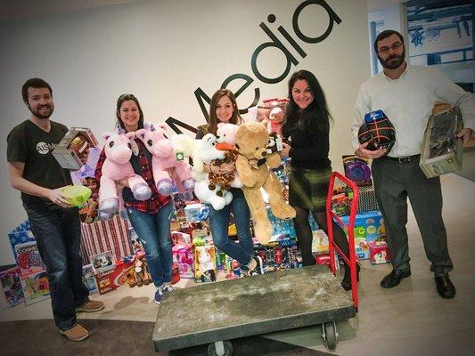 AIS Media collects for the Toys 4 Tots Drive, presenting our bounty!