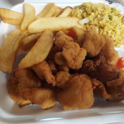 Shrimp fried rice , fries, fried fish bites, and fried chicken