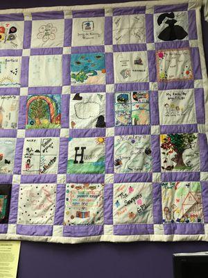 One of the quilts made with community. Our family is there.