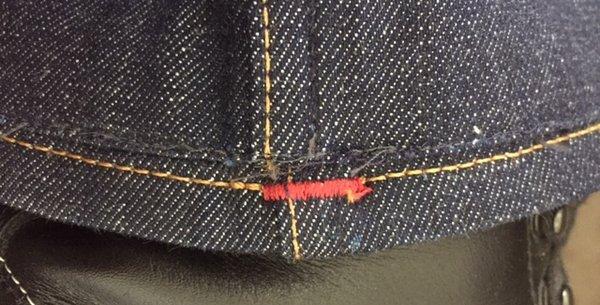 Misaligned hem job on selvedge jeans