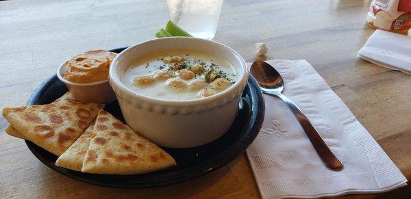 Hummus with pita wedges and clam chowder.