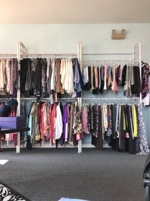 Some of the clothes on a rack.