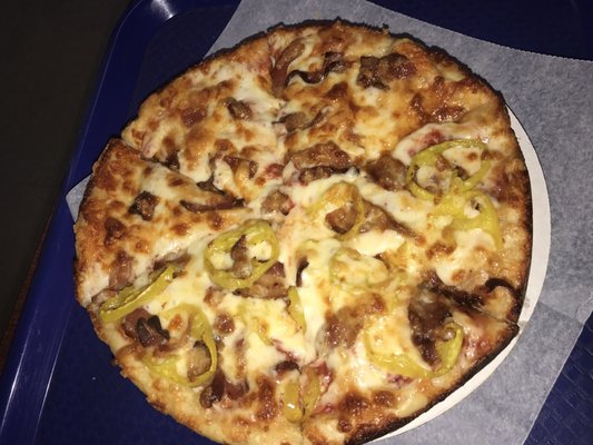 Bacon pizza half with banana peppers