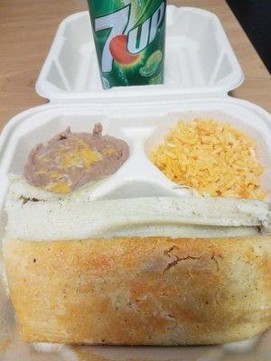 Tamale lunch special. 2 tamales, small amount of rice and beans, and a can of soda.