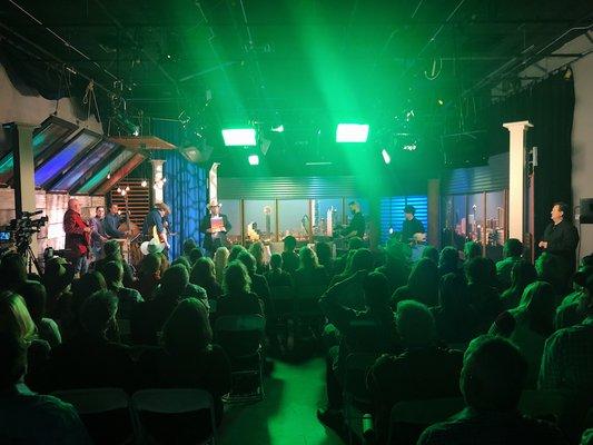 Live studio audience filming a talk show.