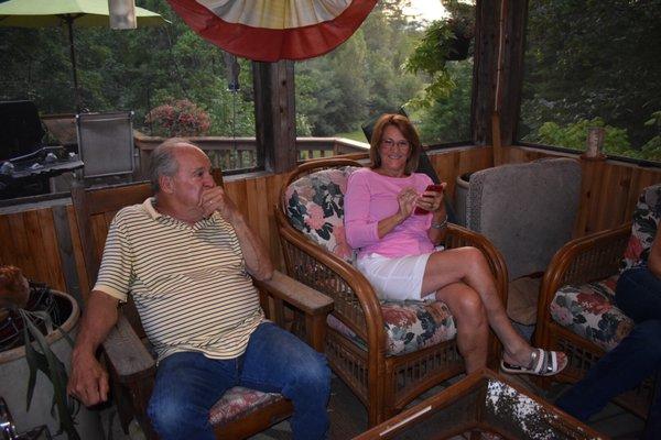 Taking a break from grilling, Terry joins the ladies in the gazebo.