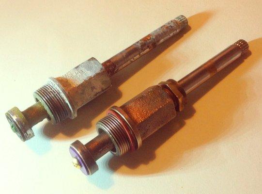 I took one of these valve stems to Stanley's to get new washers.  After Ernie finished with it it looked like new.  The other one is jealous