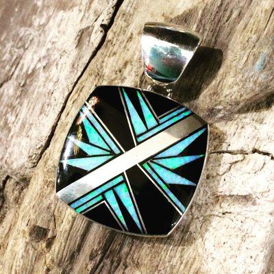 Native made inlay pendant by Kenneth Bitsie.