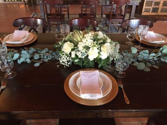 Example table setting in an upgraded farm house table at the Thurman Mansion