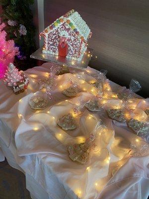 Custom pink gingerbread house and white tree cookies with pink and gold ornament decor