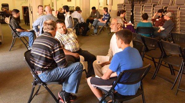 AAi compassion: Volunteers get acquainted in small buddy groups before preparing a meal for the homeless