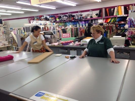 Ladies in action cutting material !!!