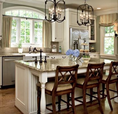 New kitchen with recessed and island chandeliers