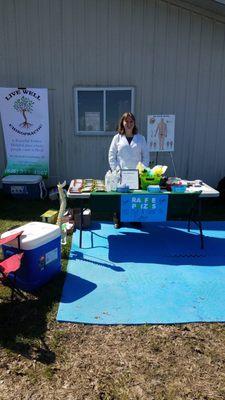 Providing water and snacks to bikers on a beautiful bike race day.