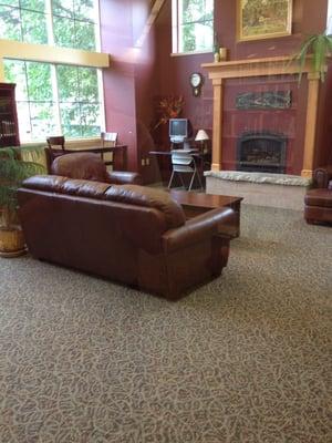 Quiet room with leather seating and a fireplace!