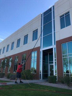 Cleaning windows on a commercial building in Scottsdale.