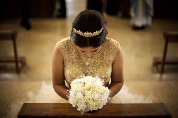 Our lovely lady as she presents herself to the church during the religious ceremony of her quinceañera.