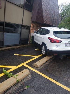 Drove over the parking block and almost hit the building