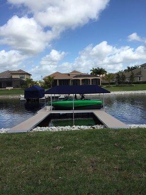 Floating dock with lift and canopy