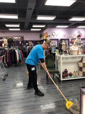 Christopher A. Murschel mopping the floor during the 2018 CPA Day of Service.  A day of volunteering!