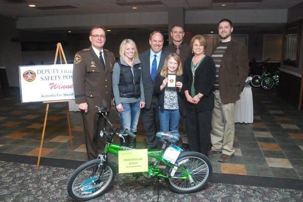 Attending the Annual Deputy Friendly Safety Poster Contest Banquet. Presenting awards and bikes to the winners. 