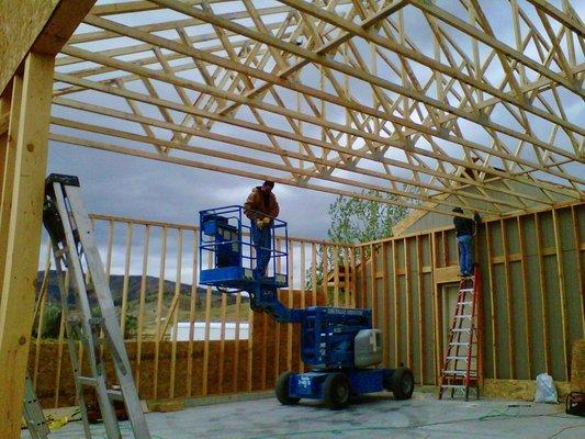 Completing a stick frame garage in the winter.