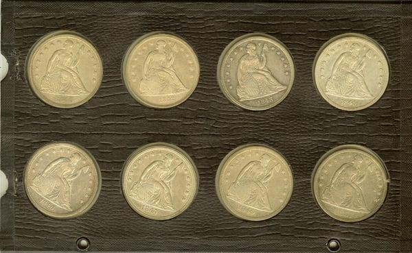 Lovely run of Liberty Seated Dollars stored for generations in this album page.