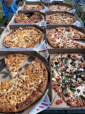 These 8 pizzas, 2 boxes of cheesy bread totaled under $100. Can't beat that!!  Delivered to the campground too!