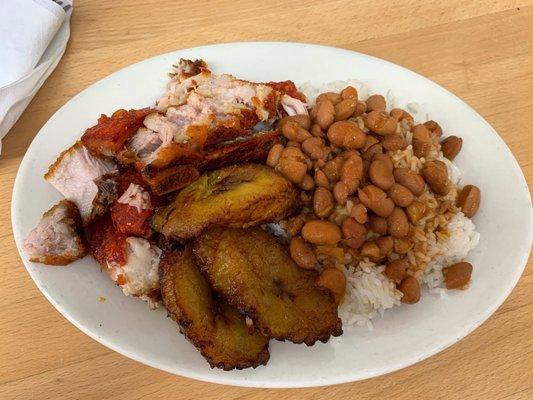 Chicharron with a side of plantains and red beans and rice