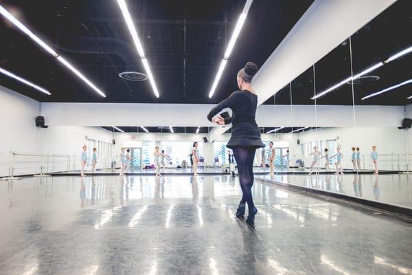 Dr. Elena D. Anderson instructing our Youth Dance Ensemble through ballet class at the Atlas. Photo Credit: Daniel Nathan