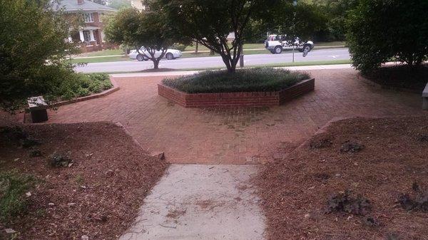 Nice shaded are with benches leading out of the park.