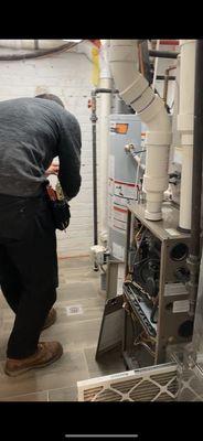 Mike inspecting our hot water heater and condenser.