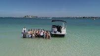 Salty Boat Rental guests find the sand bars at John's Pass to be a great place to spend the day.