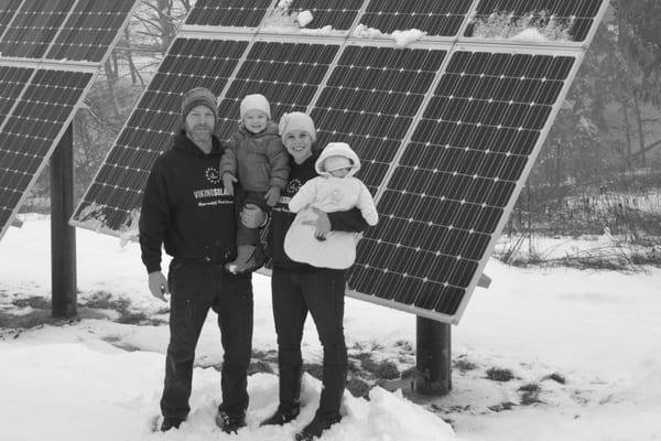 Viking Solar, Inc. owner Jamison Corallo with wife Jerrine and daughters Fiora and Isla in front of a recent solar electric ...