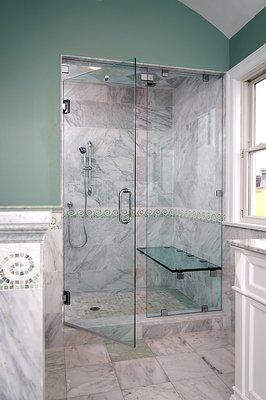 Frameless door in this elegant bathroom shower.