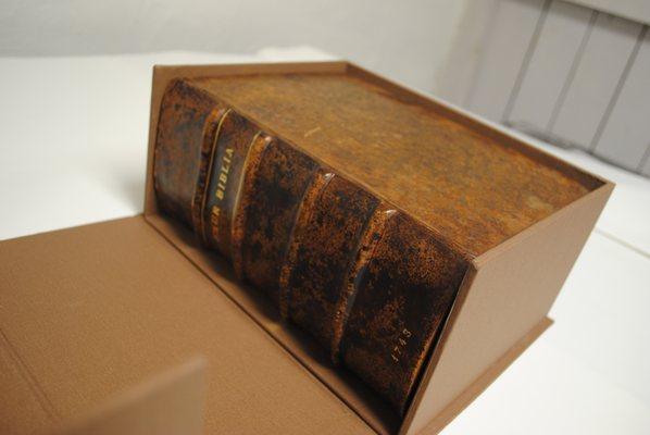 Leather restoration of 18th century German Bible and creation of a clamshell box.