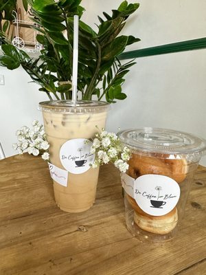 Iced oat milks latte with banana and stuffed beignets .