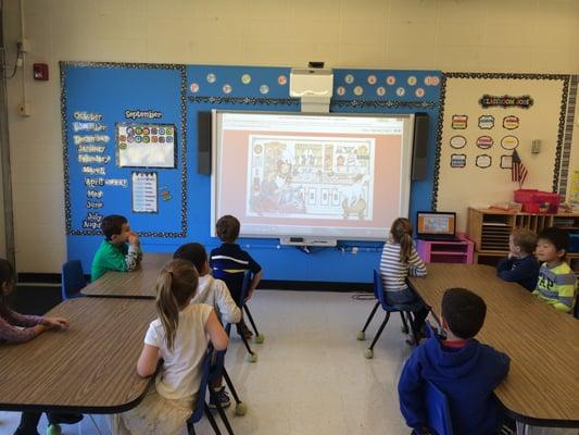 Transitional Kindergarten working on a Smart Board lesson for reading.