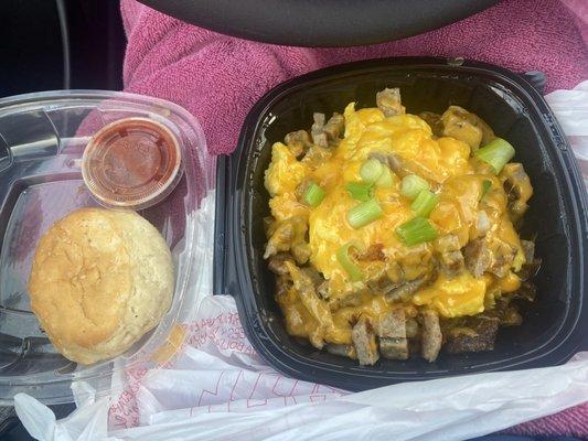 Classic breakfast bowl sausage egg potatoes and cheese biscuit side of salsa