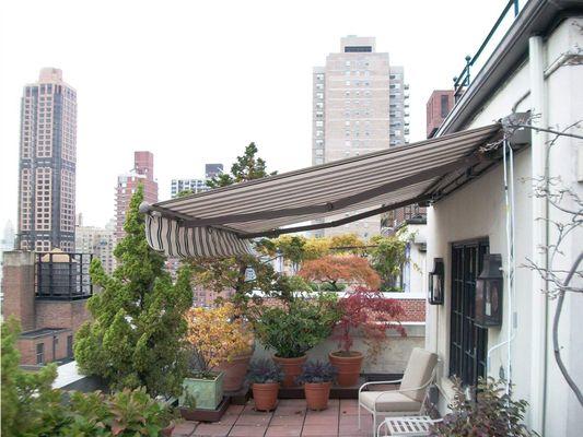 Aristocrat Estate Retractable Awning on a Pittsburgh rooftop.